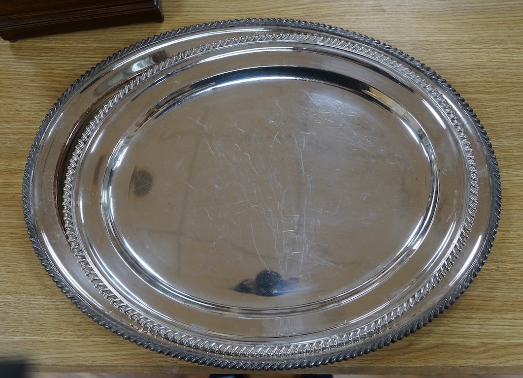 Two 19th century Old Sheffield plate oval meat plates, with gadrooned borders, largest 58.2cm. Condition - plate worn and scratched